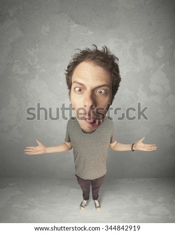 Funny person with big head on gray background