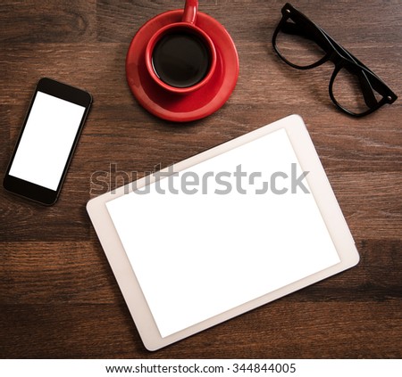 Office concept with blank screens on tablet pc and smart phone
