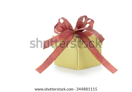 Gold color of gift box with red ribbon bow isolated on white background