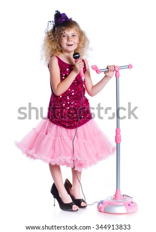 Young girl is singing with a microphone. Isolated on white background.