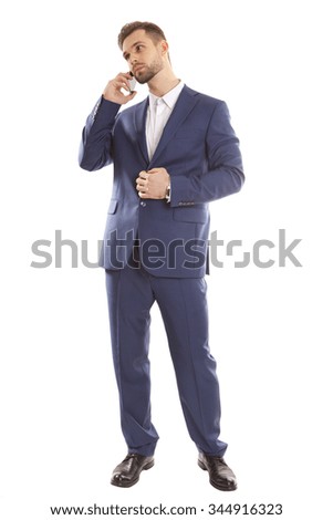 Man in a business style uses the phone