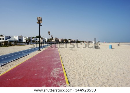 Jumeira open beach jogging and bicycle line in Dubai, UAE. Royalty-Free Stock Photo #344928530