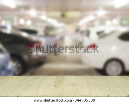 soft focus wooden table with blur cars parking