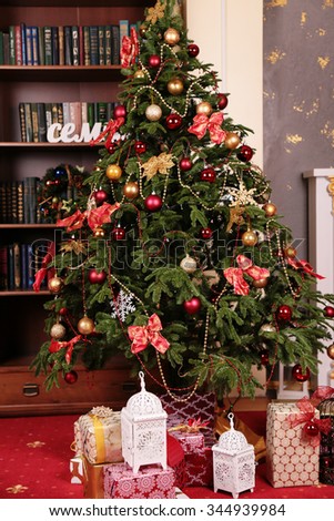 holiday photo of cozy home interior, with Christmas tree and New Year decoration  