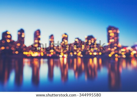 Abstract Background of Beautiful Out of Focus City Lights, Blurred View of City Skyline at Sunset