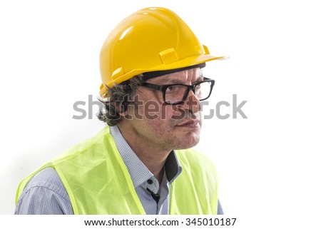Construction engineer . Portrait of an handsome engineer isolated on white . 