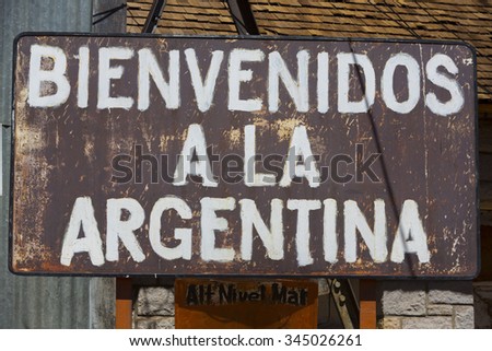 Rusted old retro sign saying welcome to Argentina written in Spanish at old train station at the border of Chile and Argentina near the Aconcagua National Park. Argentina