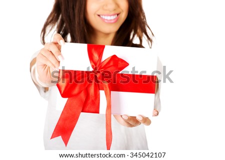 Attractive african woman with gift box.