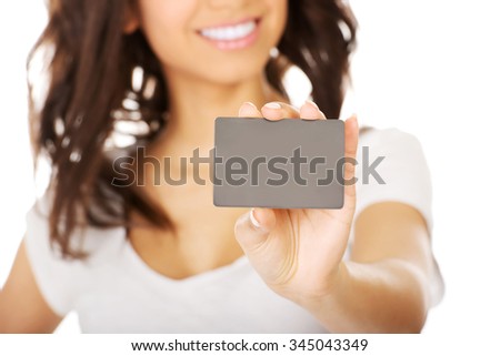 Happy african woman holding a card.
