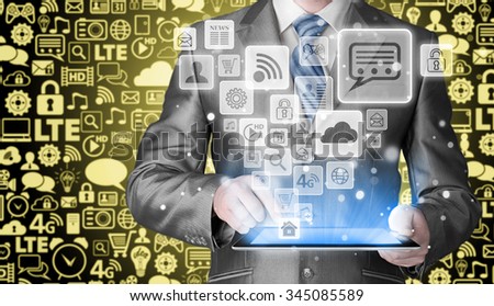 Business man using tablet PC with social media icon set
