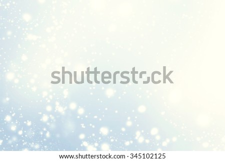 Abstract glittering stars on bokeh background.   Festive blue and white color sparkling vintage 