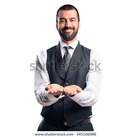 Businessman holding something