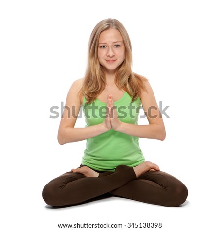 Young woman doing yoga on a white background