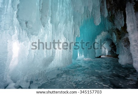 Ice cave on Olkhon island on Baikal lake in Siberia at winter time Royalty-Free Stock Photo #345157703