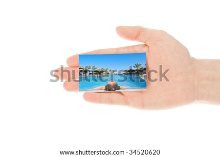 Hand and a travel card isolated on white