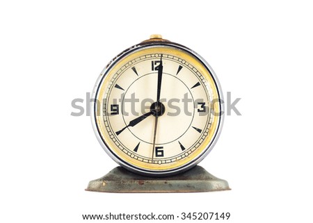 Big old vintage alarm clock isolated on white background