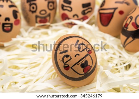 Image of fresh raw eggs with face expression on soft paper