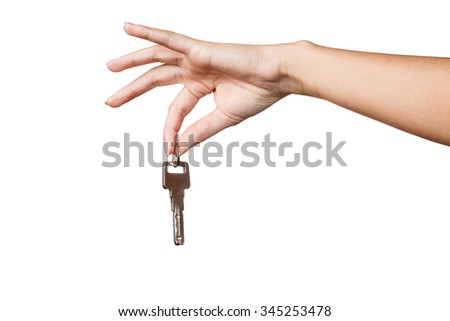 Beautiful woman hand with a key  isolated on white background