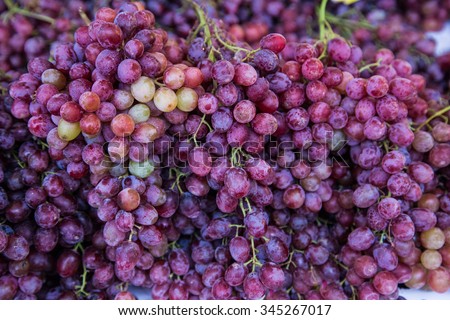 Red wine grapes background/ dark grapes, blue grapes Royalty-Free Stock Photo #345267017