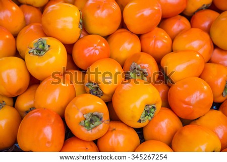 Orange persimmon kaki fruits freshly Royalty-Free Stock Photo #345267254