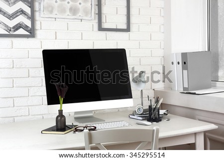 Stylish workplace with computer in home or office
