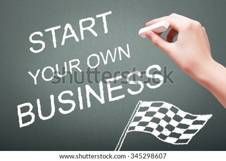 Hand writing with chalk start your own business concept on blackboard
