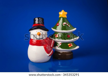 Snowman, isolated on blue background