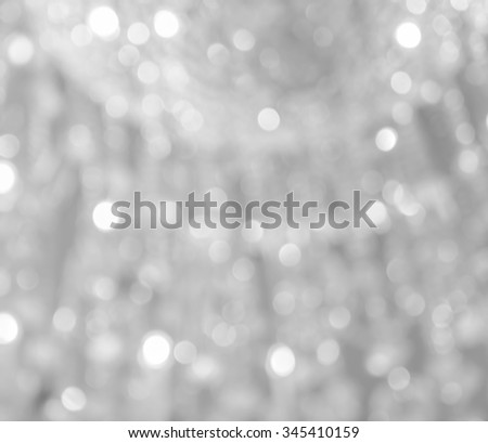 Blur lights festive bokeh background. Defocused christmas lights abstract background in black and white image