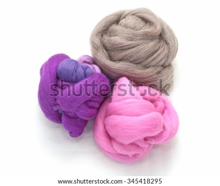 Purple, violet, lilac, pink and natural-color wool fiber balls for felting