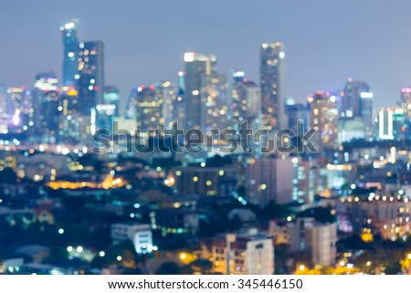 Blurred bokeh lights background of Bangkok Business park at night