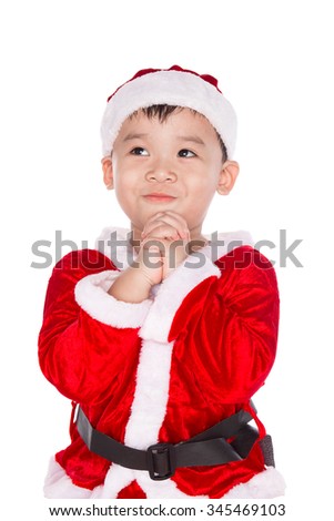 Little boy with Santa Claus hat isolated on white background