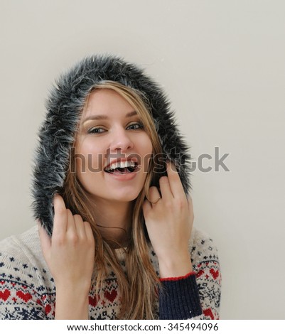 beauty face portrait of attractive young caucasian woman in warm clothing. studio shot