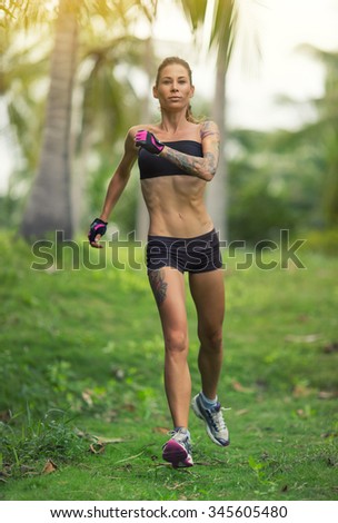 Runner - woman running training.Female fitness concept