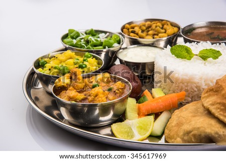 Indian Veg Thali or Restaurant style complete Food platter, selective focus Royalty-Free Stock Photo #345617969