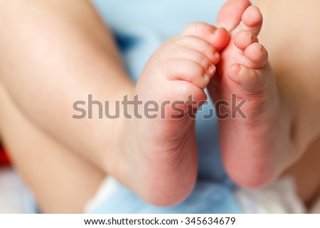 Beautiful Soft newborn baby feet close up