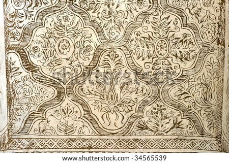 Texture of an ornate graffito wall Royalty-Free Stock Photo #34565539