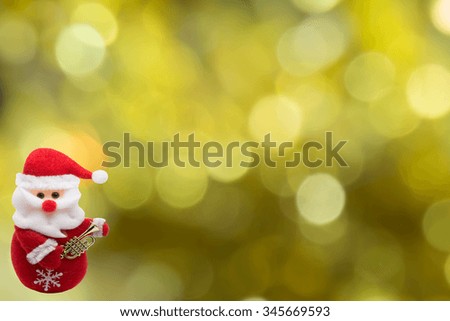 santa made from fabric on  the  bokeh background for Chrismas and new year theme