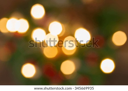 decorated christmas evergreen tree  with lights   defocused background