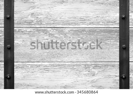 white wooden texture with black metal bar