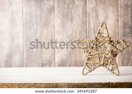 Fir branch and decor, on the wooden background.