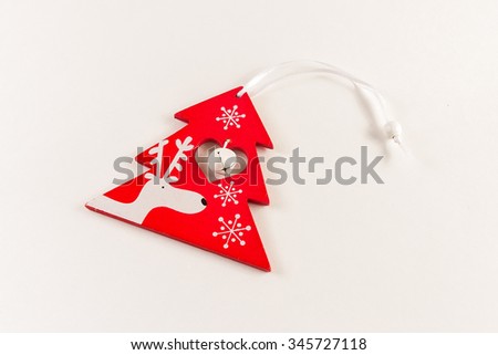 Red christmas toy with deer and bell