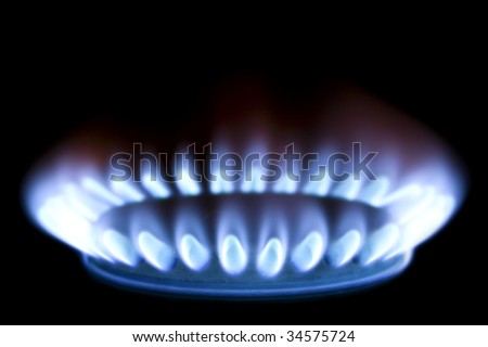 Close up of a gas burner isolated on black background