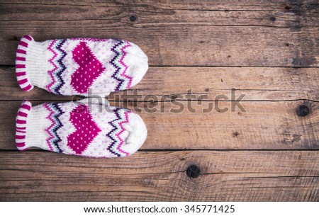 wooden background Classic gloves with cap