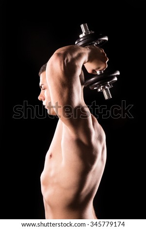 muscular man bodybuilder lifting weight, training triceps, isolated on black background