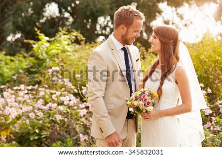 Romantic Young Couple Getting Married Outdoors Royalty-Free Stock Photo #345832031
