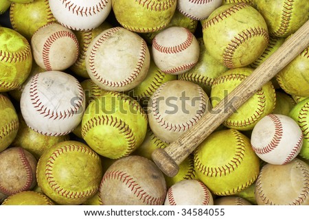 a picture of baseballs softballs and a bat
