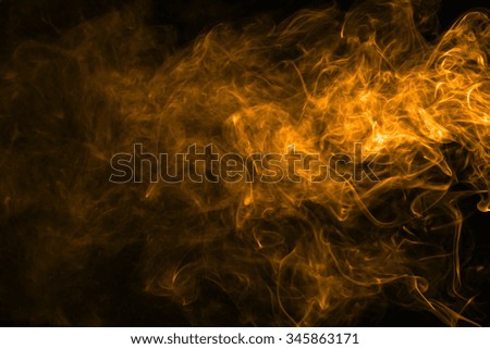 Orange movement of smoke texture on black background