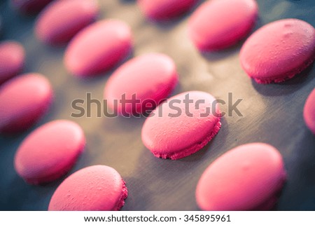 Pink macaroons baking