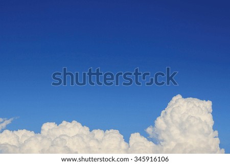 fluffy cloud on clear blue sky background