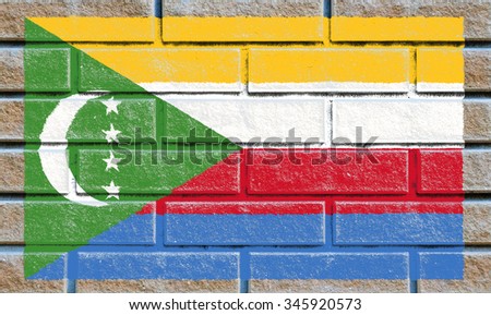 Comoros flag painted on old brick wall texture background